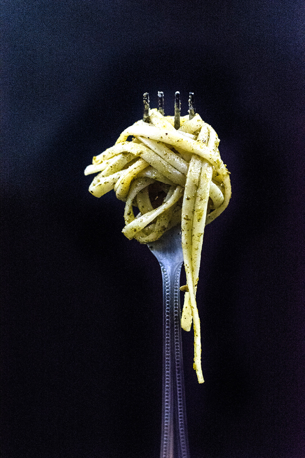 Focused Elegance: Selective Capture of a Fork with Noodle in Photography