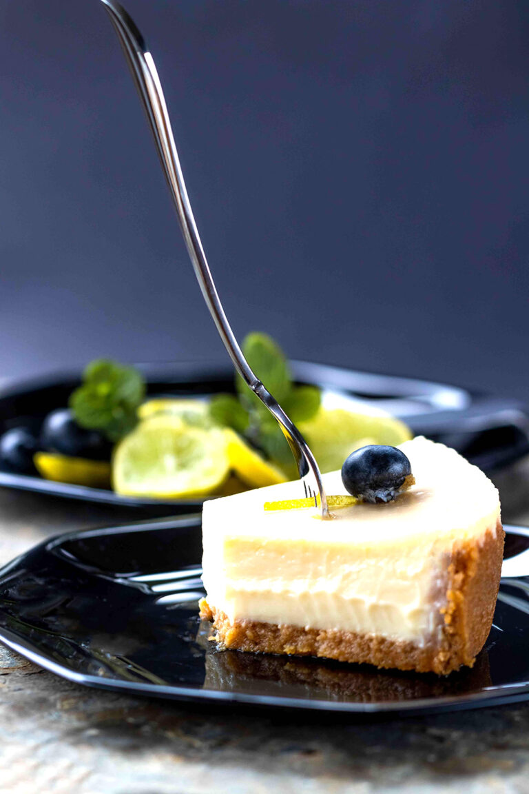 Elegant Indulgence: A Tempting Slice of Cake on a Black Plate