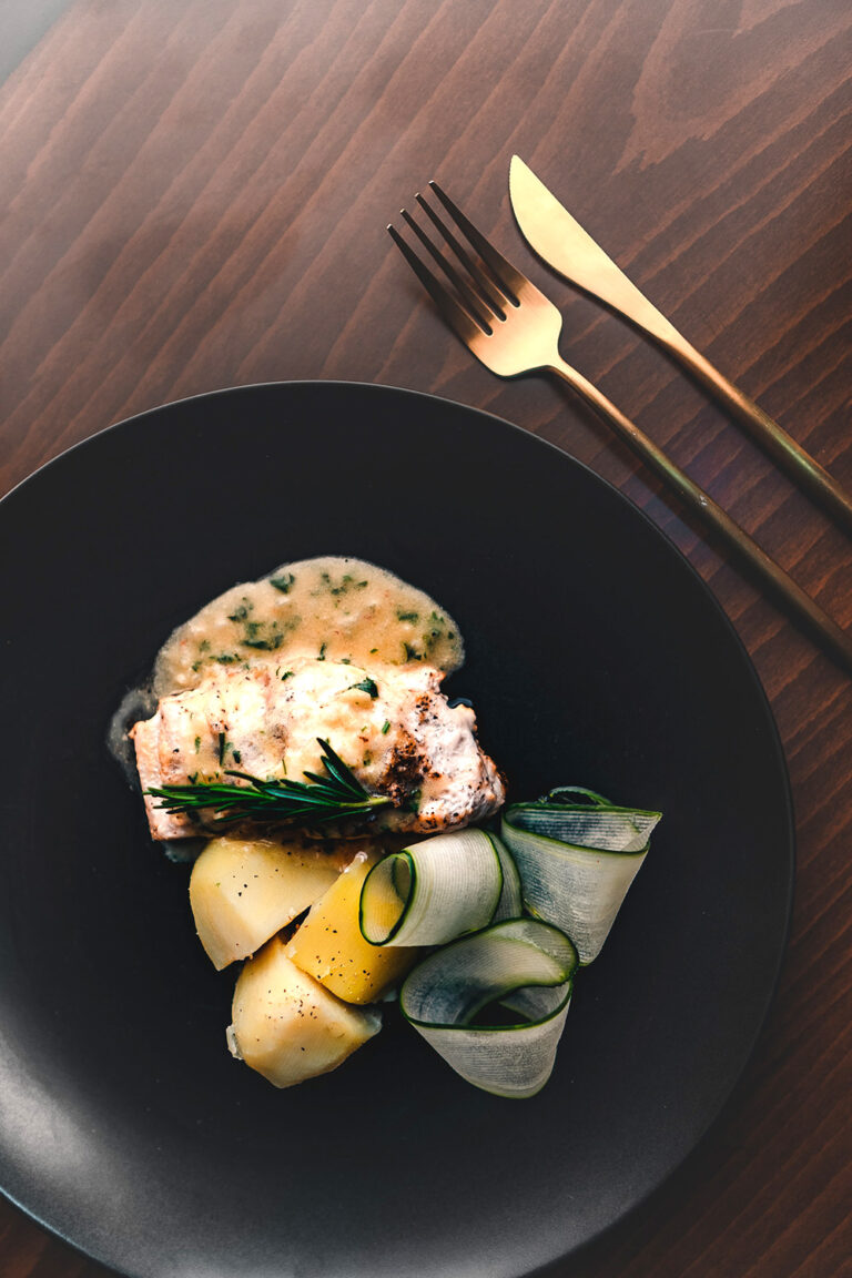 Elegant Vibrance: Sliced Vegetables Presented on a Black Plate