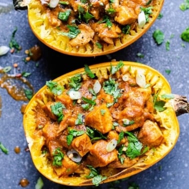 Butter chicken spaghetti squash garnished with cilantro.